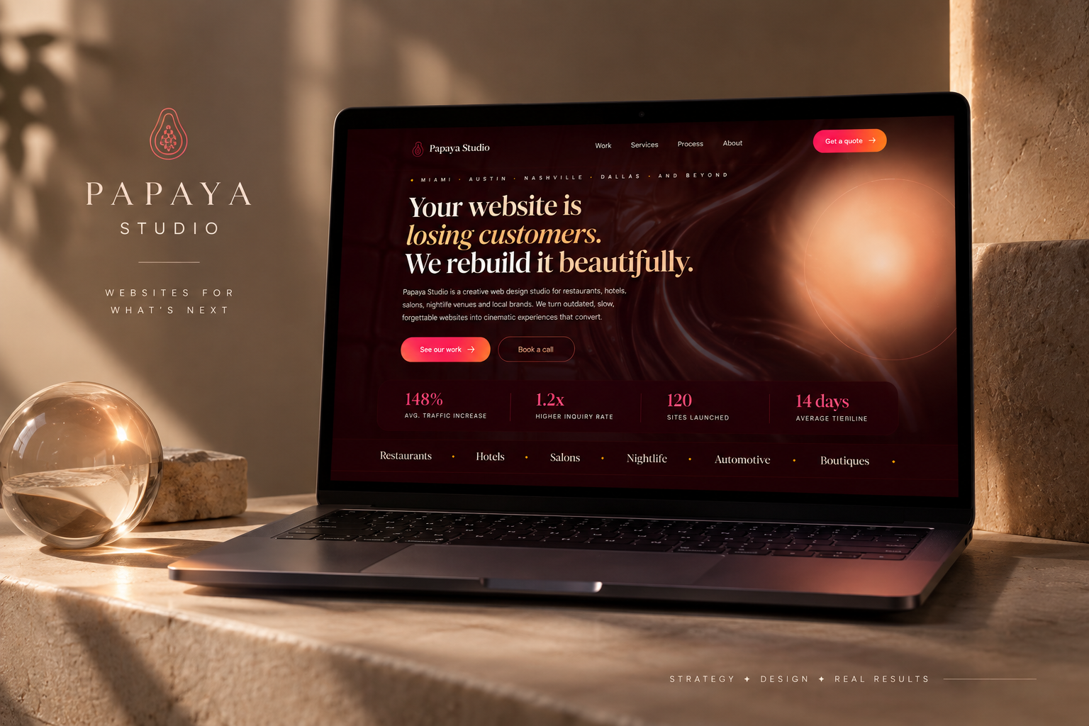 Papaya Studio website displayed on a laptop in a warm red landscape
